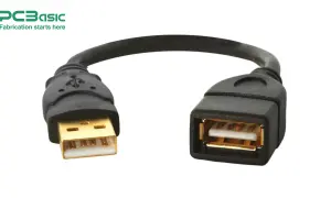 Złoty adapter USB, który pozwala na podłączenie urządzeń. Schemat połączenia jest prosty.