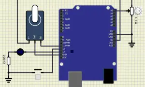 Symulator elektroniki: Arduino z potencjometrem, diodą, rezystorem 220 Ω i przyciskiem.