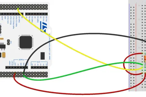 Połączenie mikrokontrolera z układem 24AA01 przez interfejs i2c. Żółty przewód to SCL, zielony to SDA.