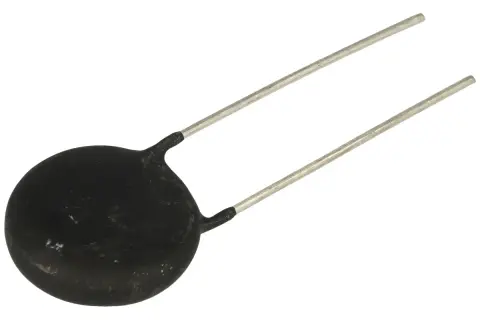 Czarny, okrągły element elektroniczny z dwoma metalowymi wyprowadzeniami. Zastanawiasz się, czym zastąpić termistor?