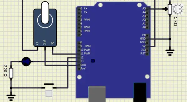 Symulator elektroniki: Arduino z potencjometrem, diodą, rezystorem 220 Ω i przyciskiem.