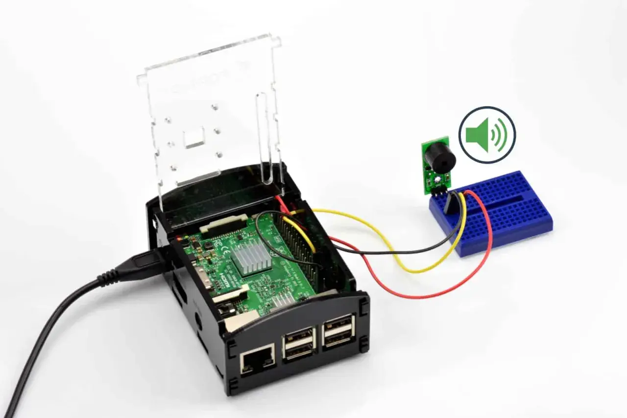 Raspberry Pi z podłączonym buzzerem przez GPIO. Dowiedz się, gpio co to i jak działa w praktyce.