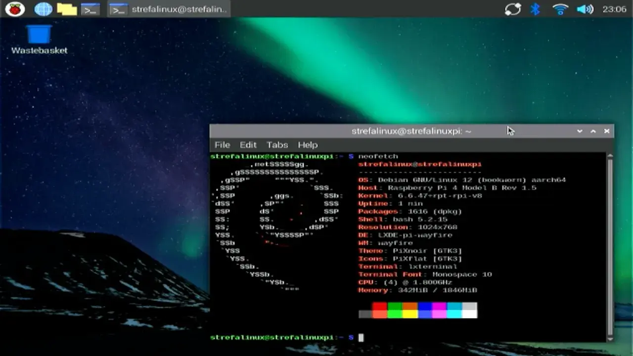 Na ekranie Raspberry Pi widać terminal z informacjami o systemie i uruchomionym programie neofetch. To idealne narzędzie do monitorowania postępów w raspberry pi programowanie.