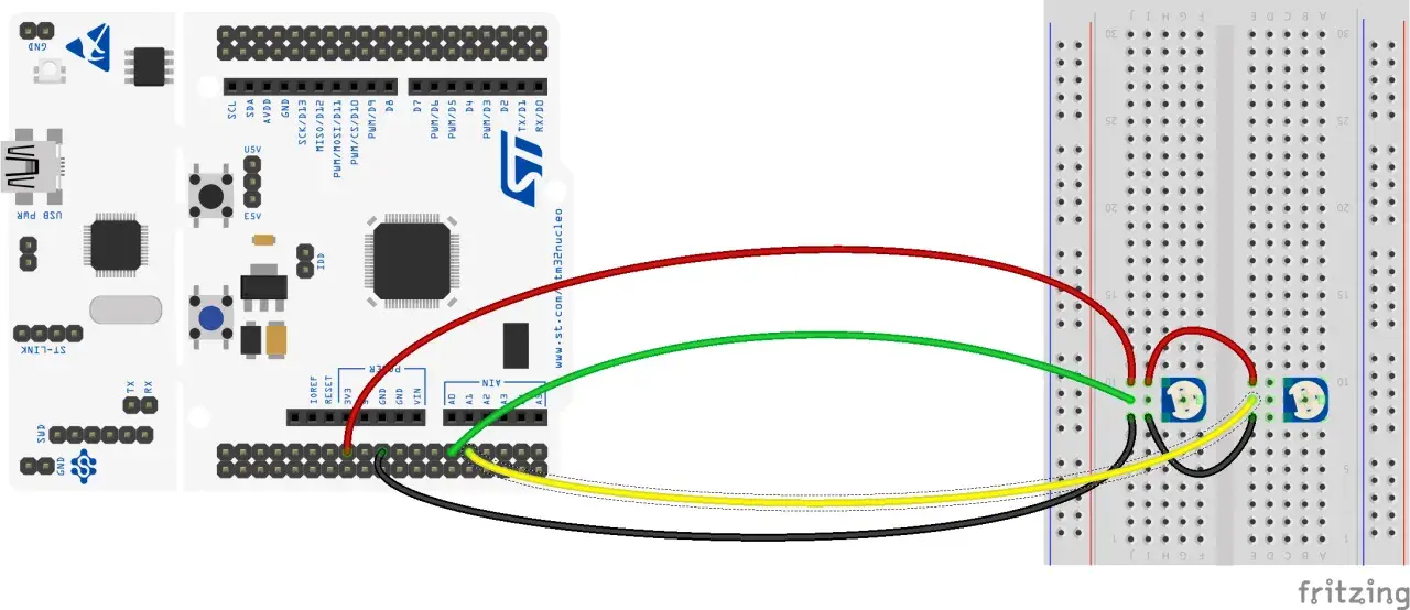 STM32 Nucleo z podłączonymi potencjometrami do breadboardu. DMA może być użyte do efektywnego przesyłania danych z potencjometrów.