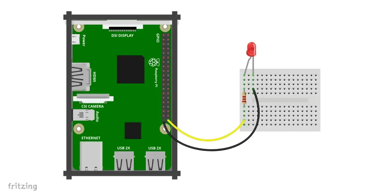 Raspberry Pi z podłączoną diodą LED i rezystorem na płytce stykowej. Idealne do nauki programowania.