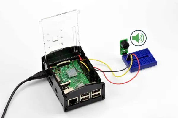 Raspberry Pi z podłączonym buzzerem przez GPIO. Dowiedz się, gpio co to i jak działa w praktyce.